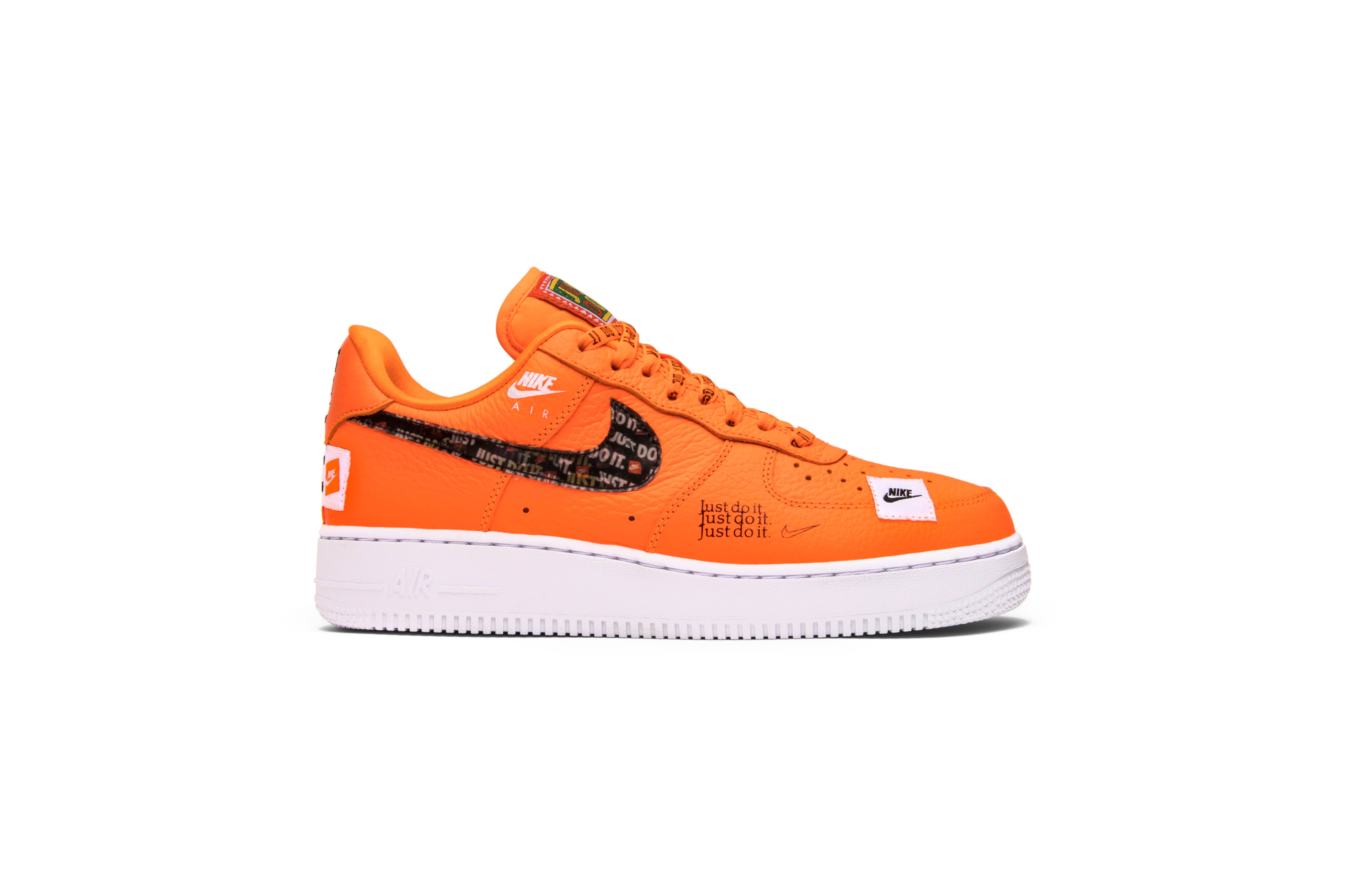 orange and white just do it air force ones