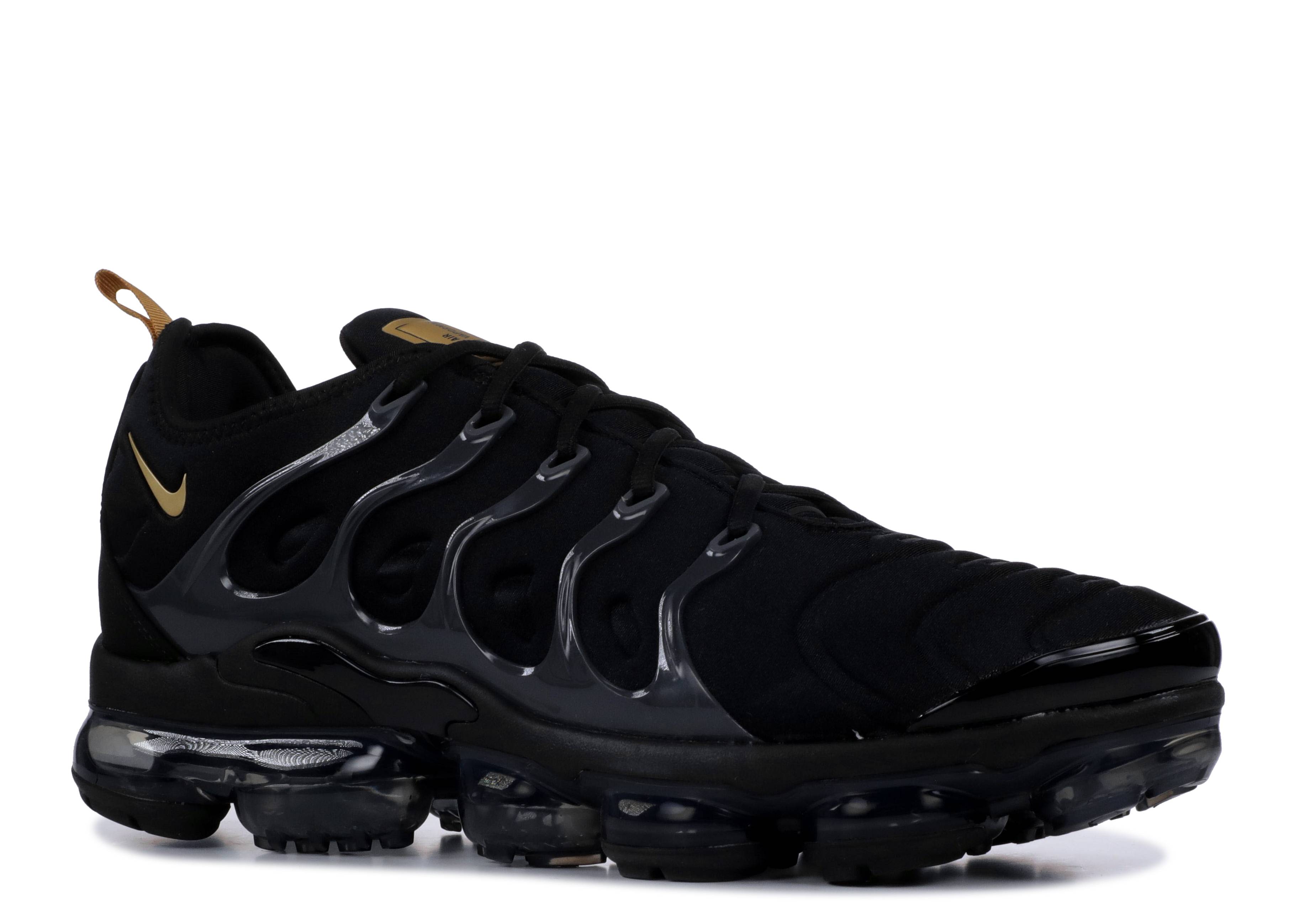 vapormax plus black and gold on feet