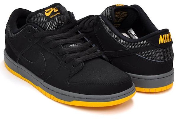 Nike sb dunk low black university gold sales