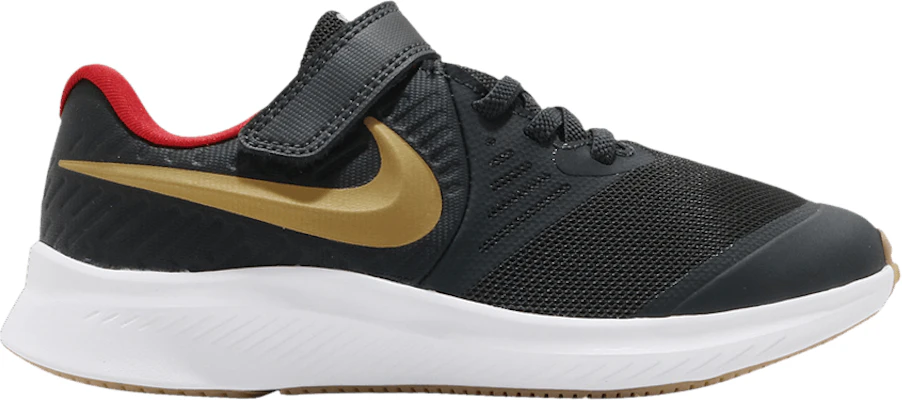 Nike star runner black and gold best sale