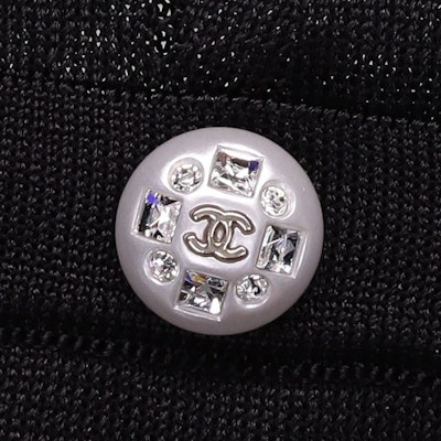 (Women) CHANEL SS23 Black Knit Top with Bow, Ruffles, and Rhinestone Buttons. P75053-K10740-94305 Purchase (Women) CHANEL SS23 Black Knit Top with Bow, Ruffles, and Rhinestone Buttons. P75053-K10740-94305