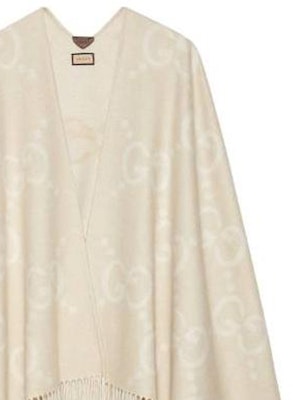 (W) 구찌 로고 자카드 프린지 케이프 카멜 컬러. 774308-4GABX-9877 Purchase (W) 구찌 로고 자카드 프린지 케이프 카멜 컬러. 774308-4GABX-9877