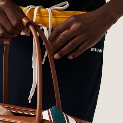 (W) MIU MIU ネイビーブルー ロゴ刺繍 ミディカジュアルニットドレス. MJD209-14RW-F0008-S-OOO Details for (W) MIU MIU ネイビーブルー ロゴ刺繍 ミディカジュアルニットドレス. MJD209-14RW-F0008-S-OOO