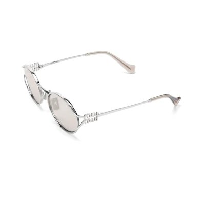 (Women) MIU MIU Silver Oval Metal Sunglasses with Logo Cutout Temples. SMU52YM1BCFE10FC054