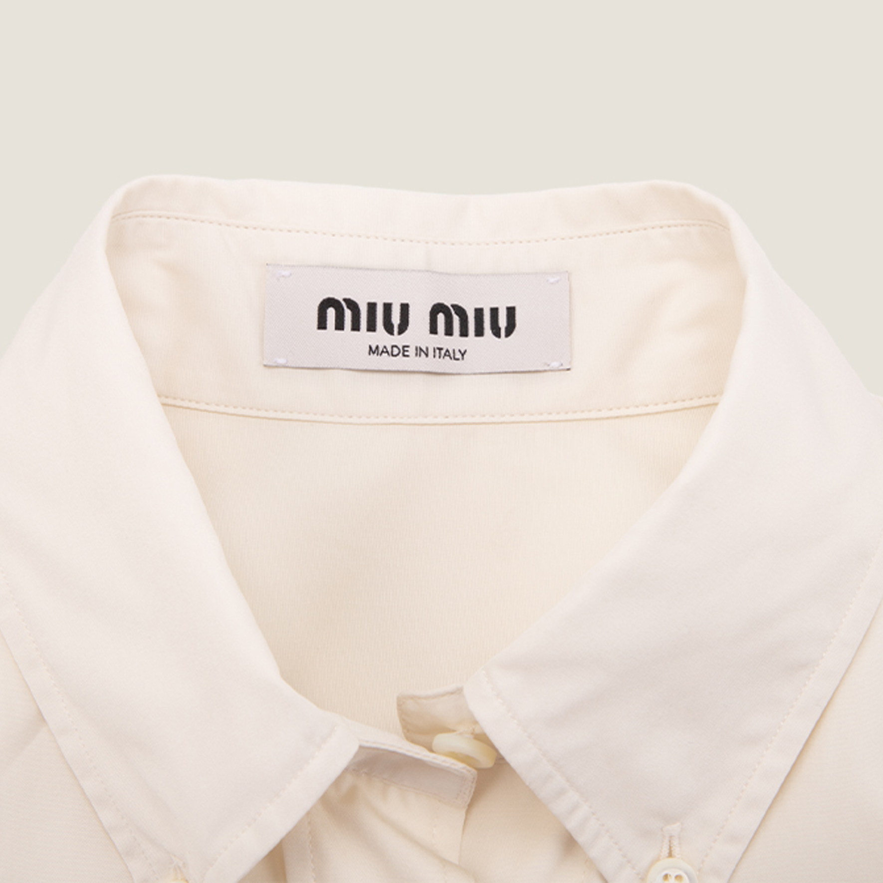 Details for (W) MIU MIU SS24 Kemeja Ivory Lengan Panjang Logo Sulam Butang. MK1694-10RG-F0304-S-OOO