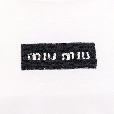 (Women) MIU MIU White FW23 Oversized Letter Knit Short Sleeve T-Shirt. MJN385-14AT-F0009-S-232 Shop (Women) MIU MIU White FW23 Oversized Letter Knit Short Sleeve T-Shirt. MJN385-14AT-F0009-S-232