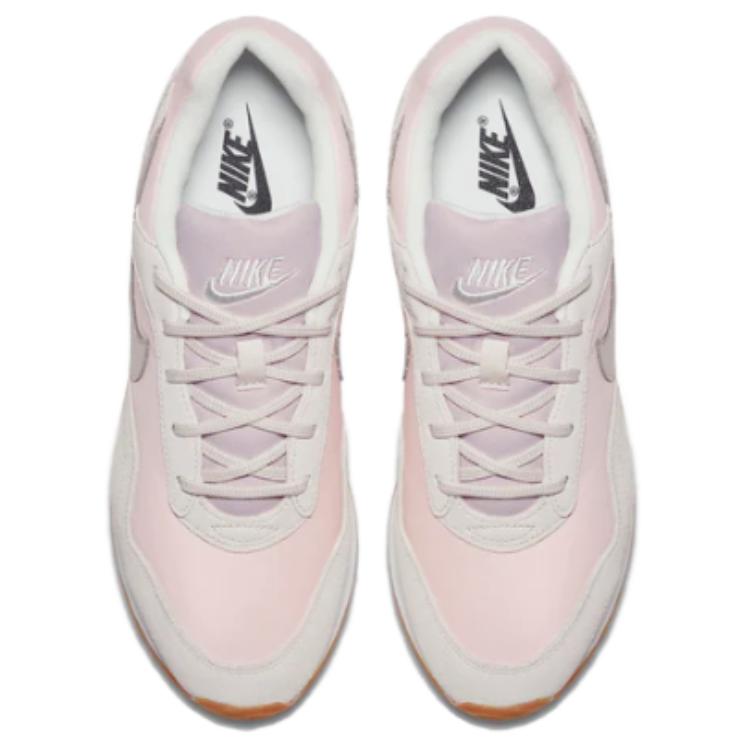 nike outburst trainers in white and pink