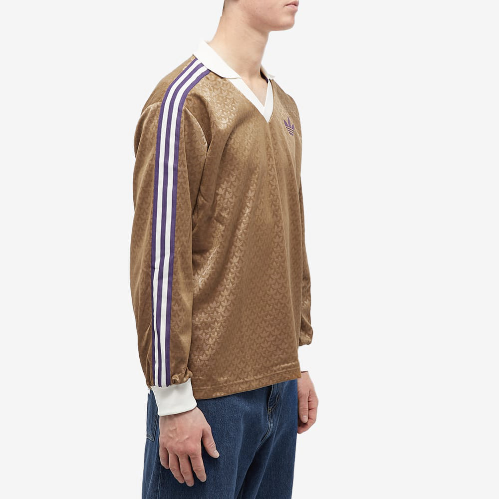Purchase adidas Originals Brown Retro V-Neck Long Sleeve T-Shirt with Logo & Side Stripes. IB3438