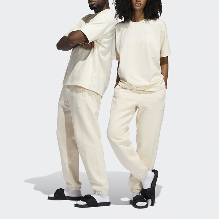 Shop adidas Originals x Pharrell Williams 聯名寬鬆版米色運動長褲 男女同款 GH4382