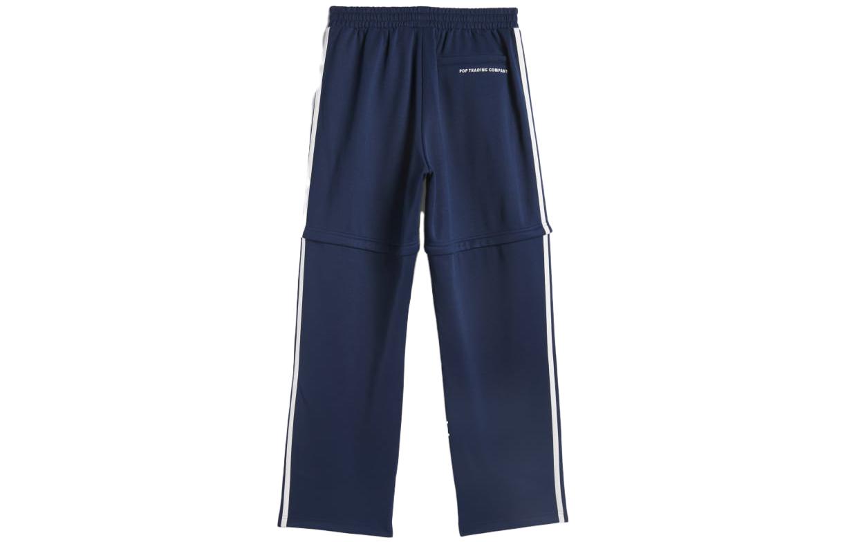 Lookbook adidas x Pop Trading Co FW23 Celana Track Retro Unisex Navy dengan Kaki Lepas. IX1975