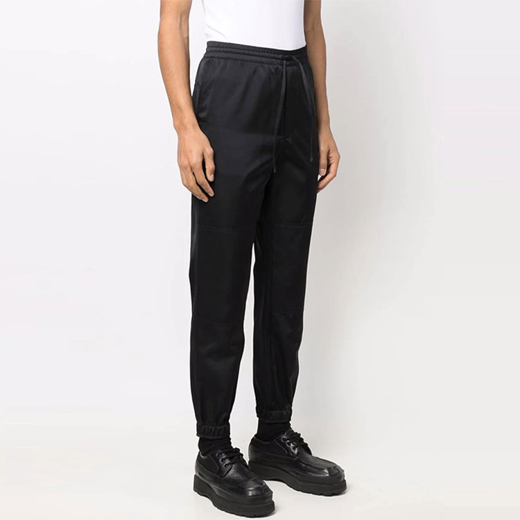 Shop Alexander McQueen SS22  Black Solid Knit Jogger Sweatpants. 678056-QSR64-1000