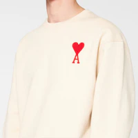 Purchase AMI PARIS Off-White Heart Logo Crewneck Sweatshirt. H20HJ034747-150