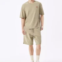 Shop AMI Paris SS24 Red Heart Drawstring Shorts Unisex in Khaki Green. USO635747-366