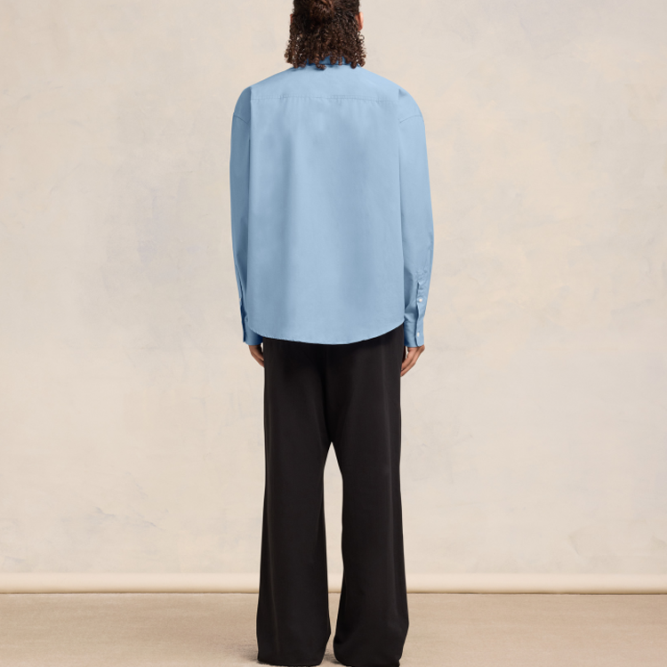 Shop AMI Paris SS24 Baju Lengan Panjang Oversized Uniseks Biru. USH116CO0063-484