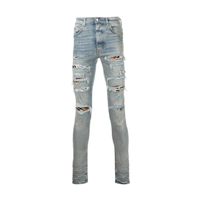 AMIRI Distressed Skinny Ripped Jeans - Blue. PS22MDS250-408