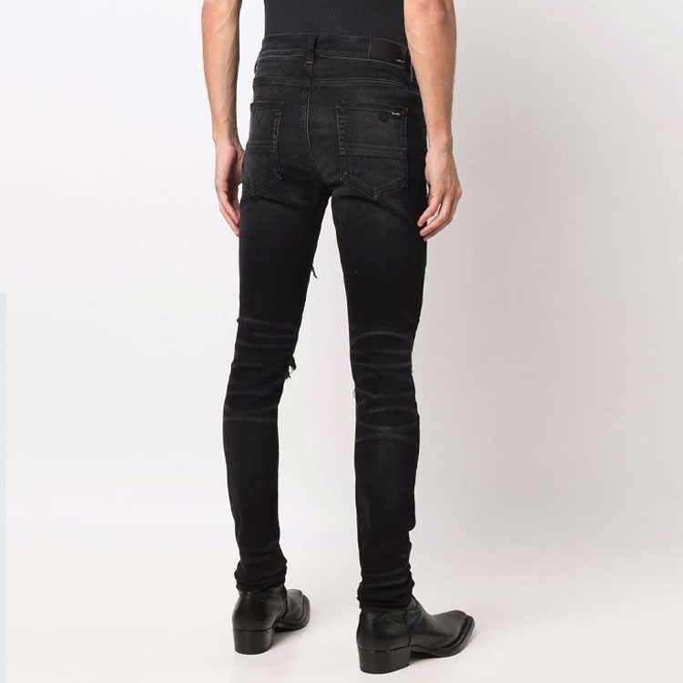 Shop AMIRI 修身破洞牛仔褲 黑色 MDS055-023