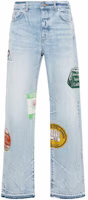 AMIRI Light Blue Travel Patchwork Straight Cut Raw Hem Jeans. AMDNGG1001 AMIRI Light Blue Travel Patchwork Straight Cut Raw Hem Jeans. AMDNGG1001