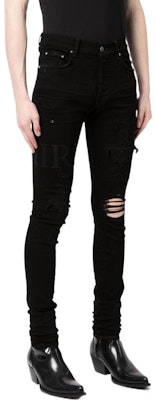 Vaqueros de mezclilla negros con logo desgastado en las rodillas AMIRI SS23. PS23MDS006-018 Purchase Vaqueros de mezclilla negros con logo desgastado en las rodillas AMIRI SS23. PS23MDS006-018