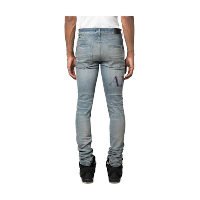 AMIRI SS23 Solid Color Distressed Knee Logo Denim Jeans Blue . PS23MDS006-408