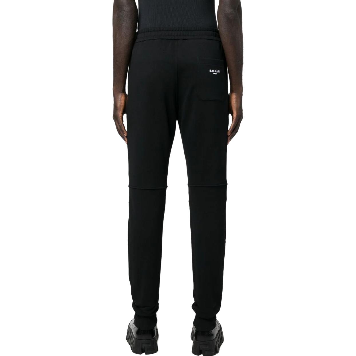 Shop BALMAIN  Logo Print Drawstring Knit Joggers in Dark Black. AH0OB000BB04-EAB