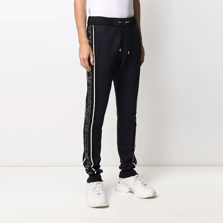 Purchase BALMAIN FW21 Knit Joggers with Side Logo Patch Black. WH1OB021-273J-SDO