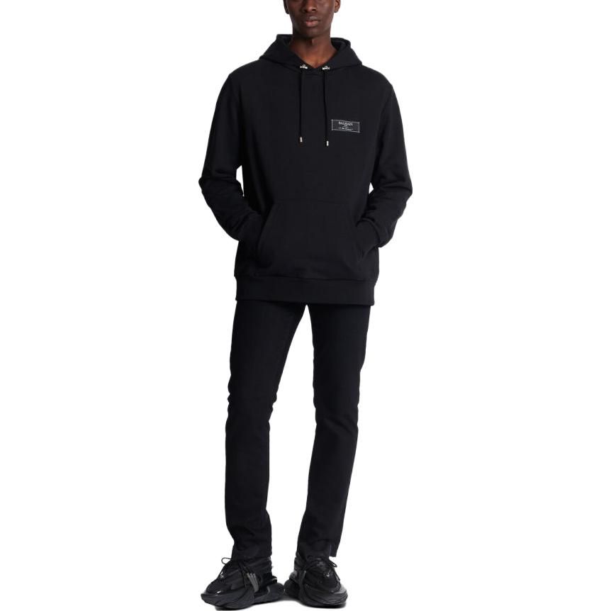Lookbook BALMAIN FW23  Black Hoodie with Solid Logo Patch. BH0JT047-JB53-0PA