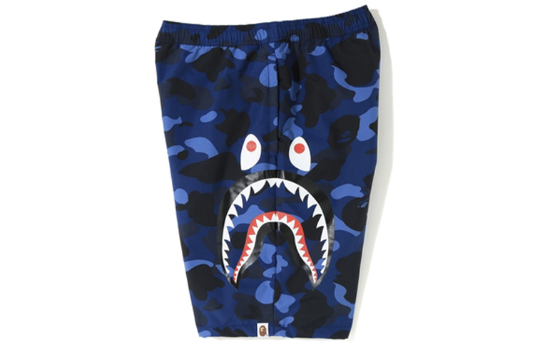 Shop Bape A BATHING APE 鯊魚系列迷彩藍鯊魚短褲 男女適用款。 1F30-153-019