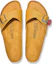 Shop Birkenstock 皮革 舒適萬用履帶 平底拖鞋 男女款 黃色 窄型