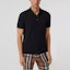 Shop Polo de Manga Corta Negro Sólido con Botones para Hombre de Burberry. 80374351
