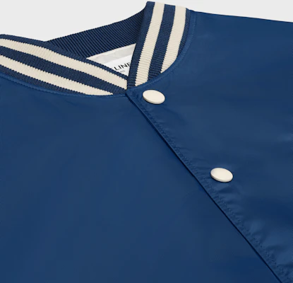 CELINE Men’s Navy Blue SS24 Logo Print Loose-Fit Varsity Jacket. 2W22C227R-07MR Purchase CELINE Men’s Navy Blue SS24 Logo Print Loose-Fit Varsity Jacket. 2W22C227R-07MR