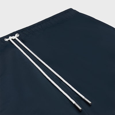 CELINE Triomphe Solid Drawstring Swim Trunks Navy Blue Swimwear. 2Z732519U-07MR Shop CELINE Triomphe Solid Drawstring Swim Trunks Navy Blue Swimwear. 2Z732519U-07MR