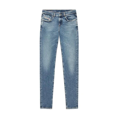 DIESEL SS23 Slim Fit Washed Button Jeans in Blue. A0356209F1601