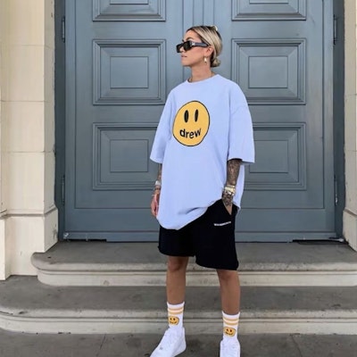 Drew House Smile Face Mascot Baju-T Uniseks Biru Muda DR-SS21-70 Shop Drew House Smile Face Mascot Baju-T Uniseks Biru Muda DR-SS21-70