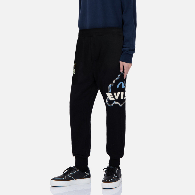 Shop EVISU 黑色中腰側條紋佛頭印花運動長褲。 2EAHTM2SP351XXCT