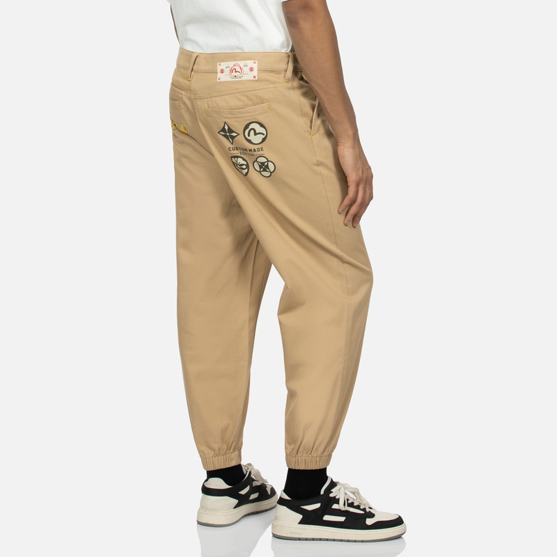 Shop EVISU SS24 花卉與標誌印花織布休閒運動長褲 2ESHTM4PO1025FFCT