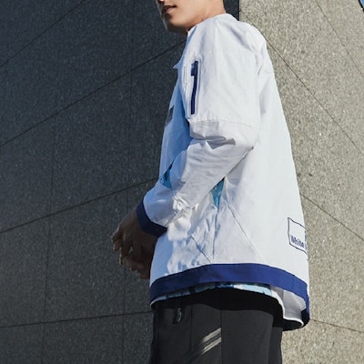 FILA Fusion x White Mountaineering White Woven Jacket Collaborative Series. T11M227701F-WT Shop FILA Fusion x White Mountaineering White Woven Jacket Collaborative Series. T11M227701F-WT