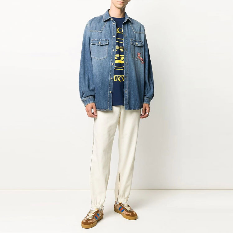 Lookbook Pantalones Jogger Beige GUCCI FW21 con Rayas Laterales y Logo para Hombre. 615775-XDBBI-9069