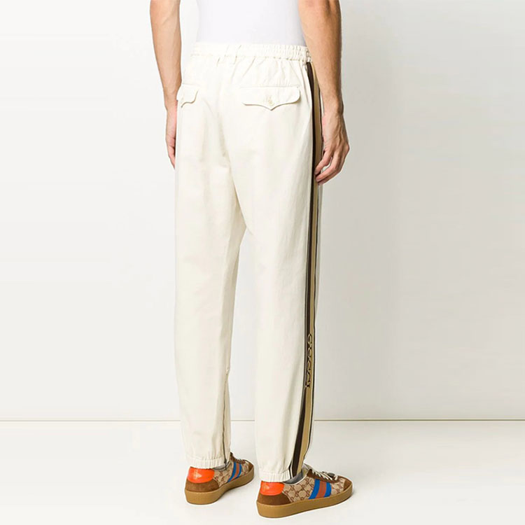 Purchase Pantalones Jogger Beige GUCCI FW21 con Rayas Laterales y Logo para Hombre. 615775-XDBBI-9069