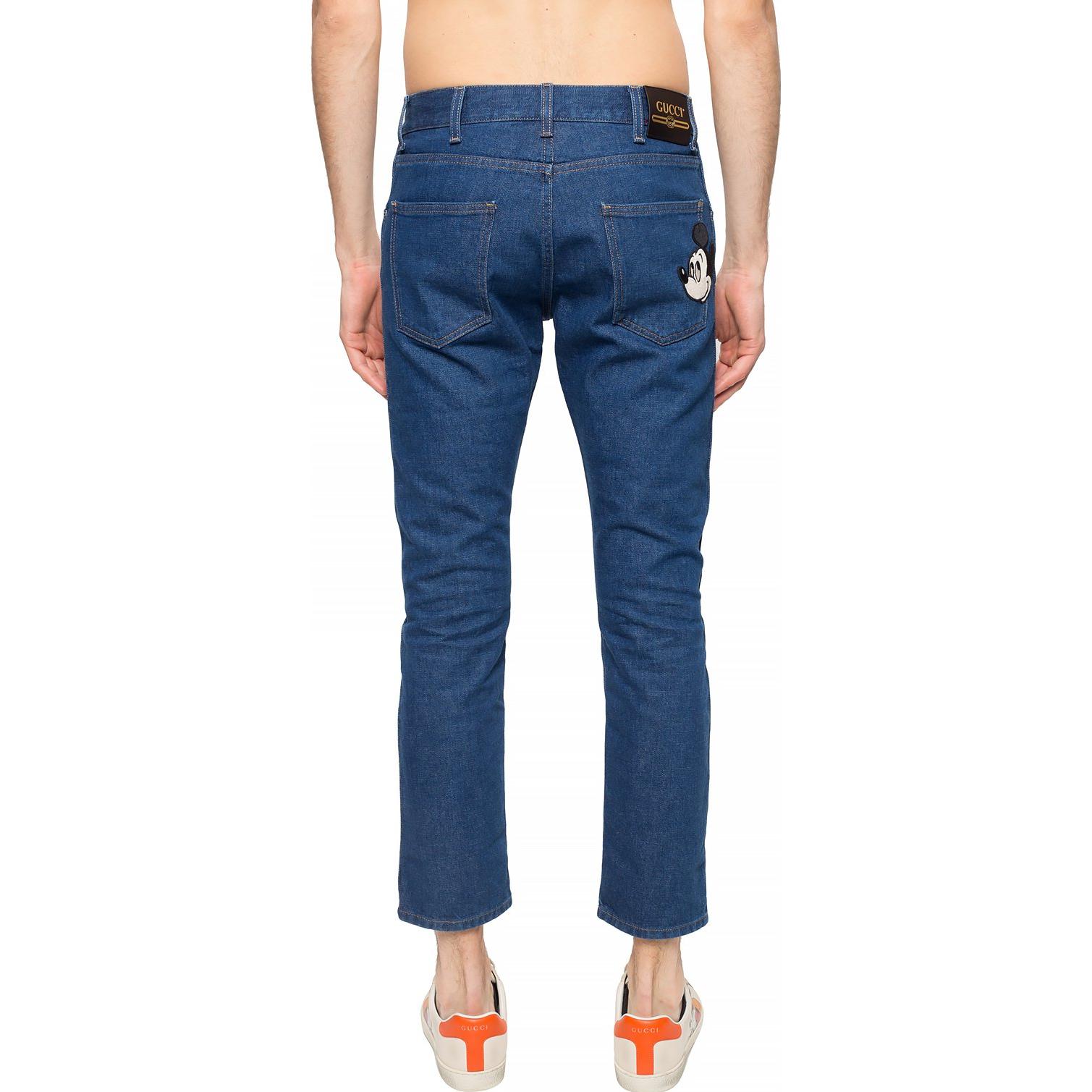 Purchase 구찌 x 디즈니 테이퍼드 블루 진 지퍼 및 패치 디테일. 408637-XDA13-4206