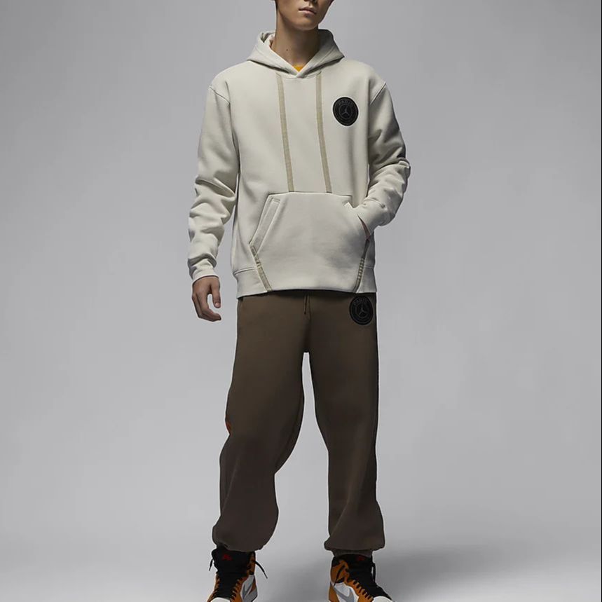 Shop Jordan PSG Logo Pullover Fleece Hoodie Light Bone Color DZ2924-072