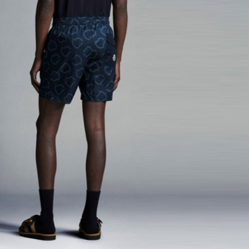 Purchase Moncler SS22  Navy All-Over Logo Print Drawstring Swim Shorts. 2C0002059630778