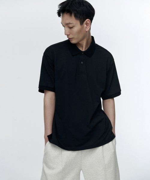 Shop MUSINSA STANDARD [涼感標準] 寬鬆剪裁珠地布 polo 衫 [黑色] MMCTP6Z06-BK