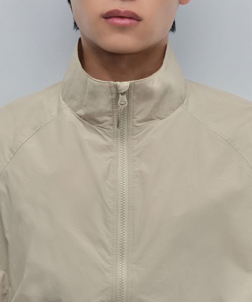 Shop Musinsa Standard Oversized High-Neck Windbreaker Jacket [Light Beige] MMDJJ5Z01-LB
