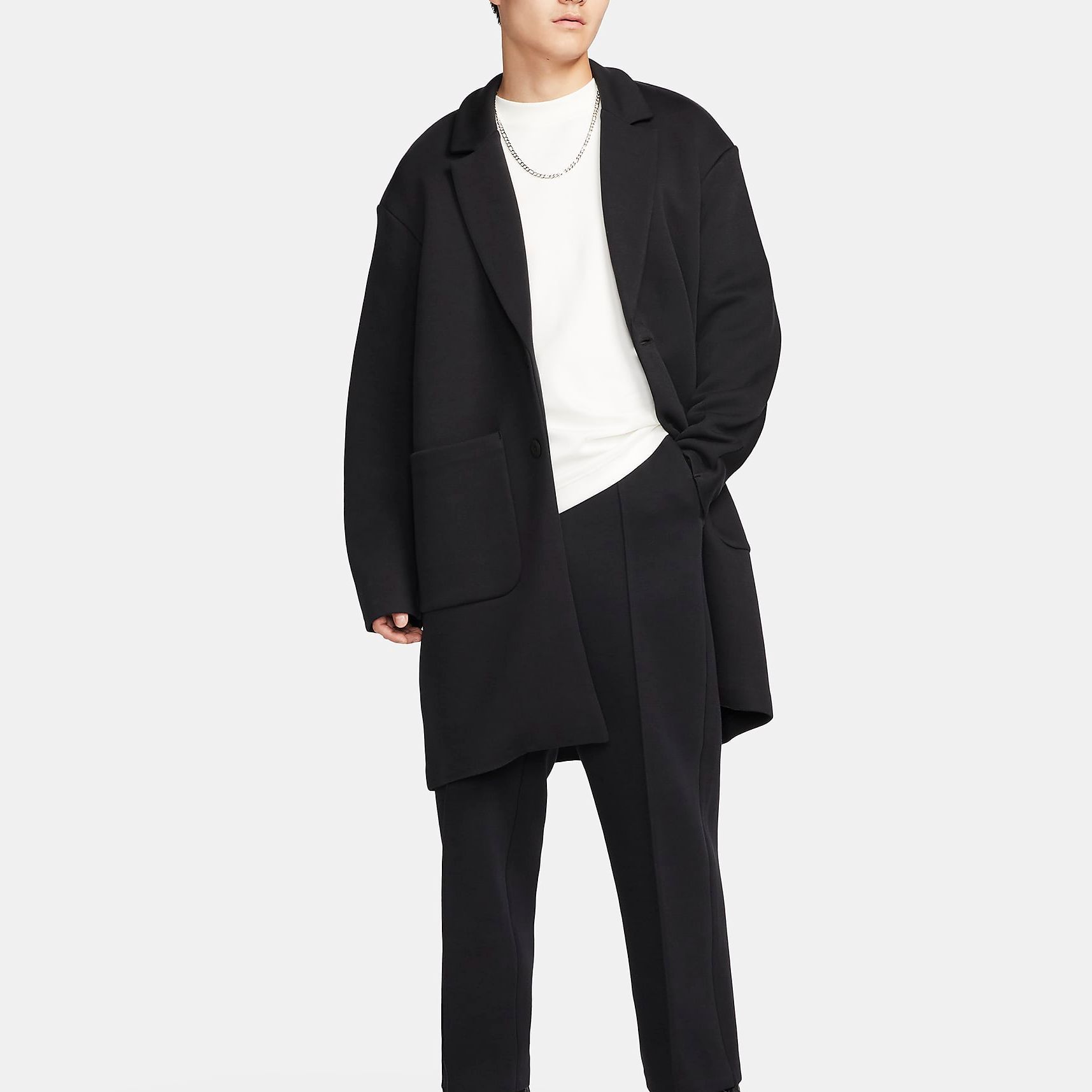 Shop Nike  Black Loose Fit Single-Breasted Long Sleeve Trench Coat. FN0602-010