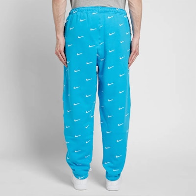 Nike All Over Swoosh Logo Pants Blue Shop Nike All Over Swoosh Logo Pants Blue