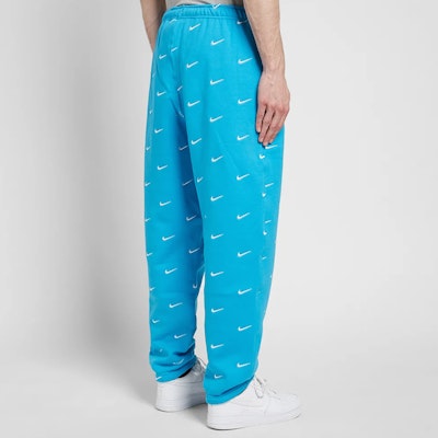 Nike All Over Swoosh Logo Pants Blue Purchase Nike All Over Swoosh Logo Pants Blue