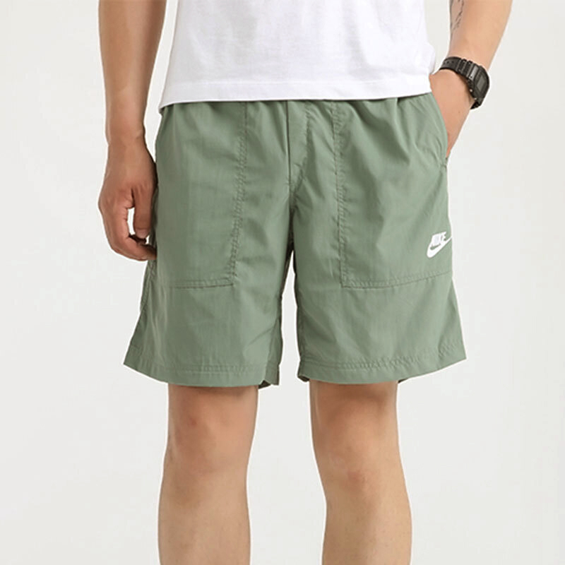 Shop Nike Sportswear Light Green Woven Training Shorts with Large Pocket CU4472-353