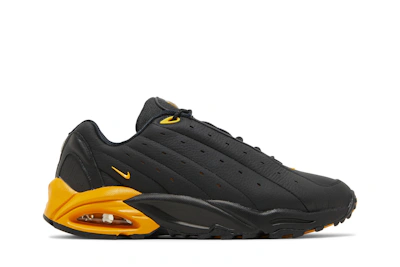NOCTA x Nike Hot Step Air Terra 'Black University Gold'