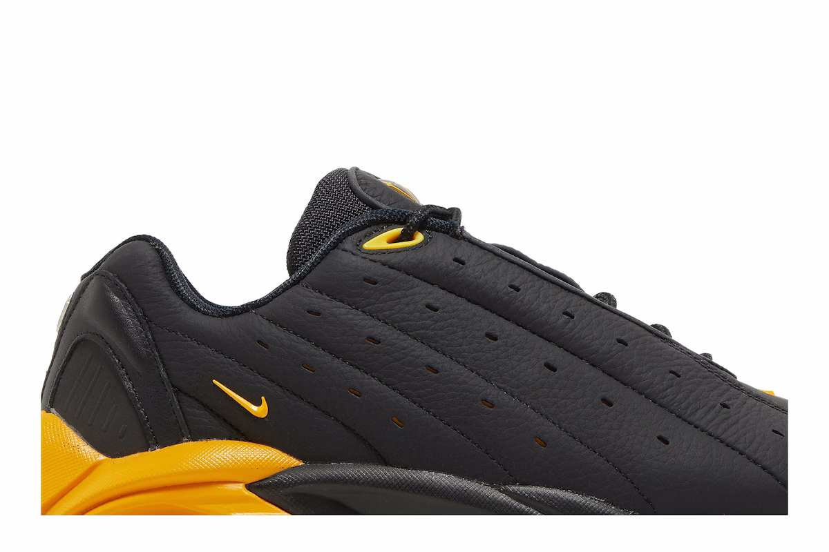NOCTA x Nike Hot Step Air Terra 'Black University Gold'
