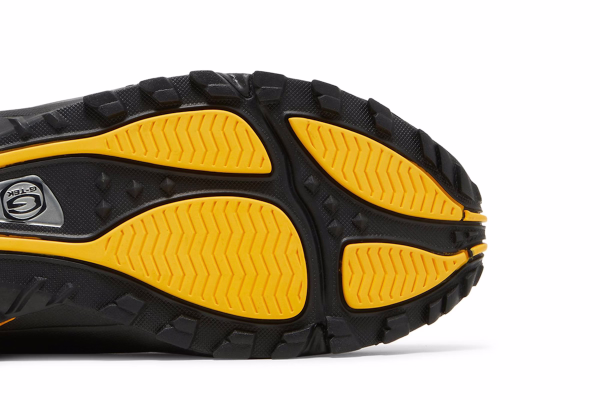 NOCTA x Nike Hot Step Air Terra 'Black University Gold'